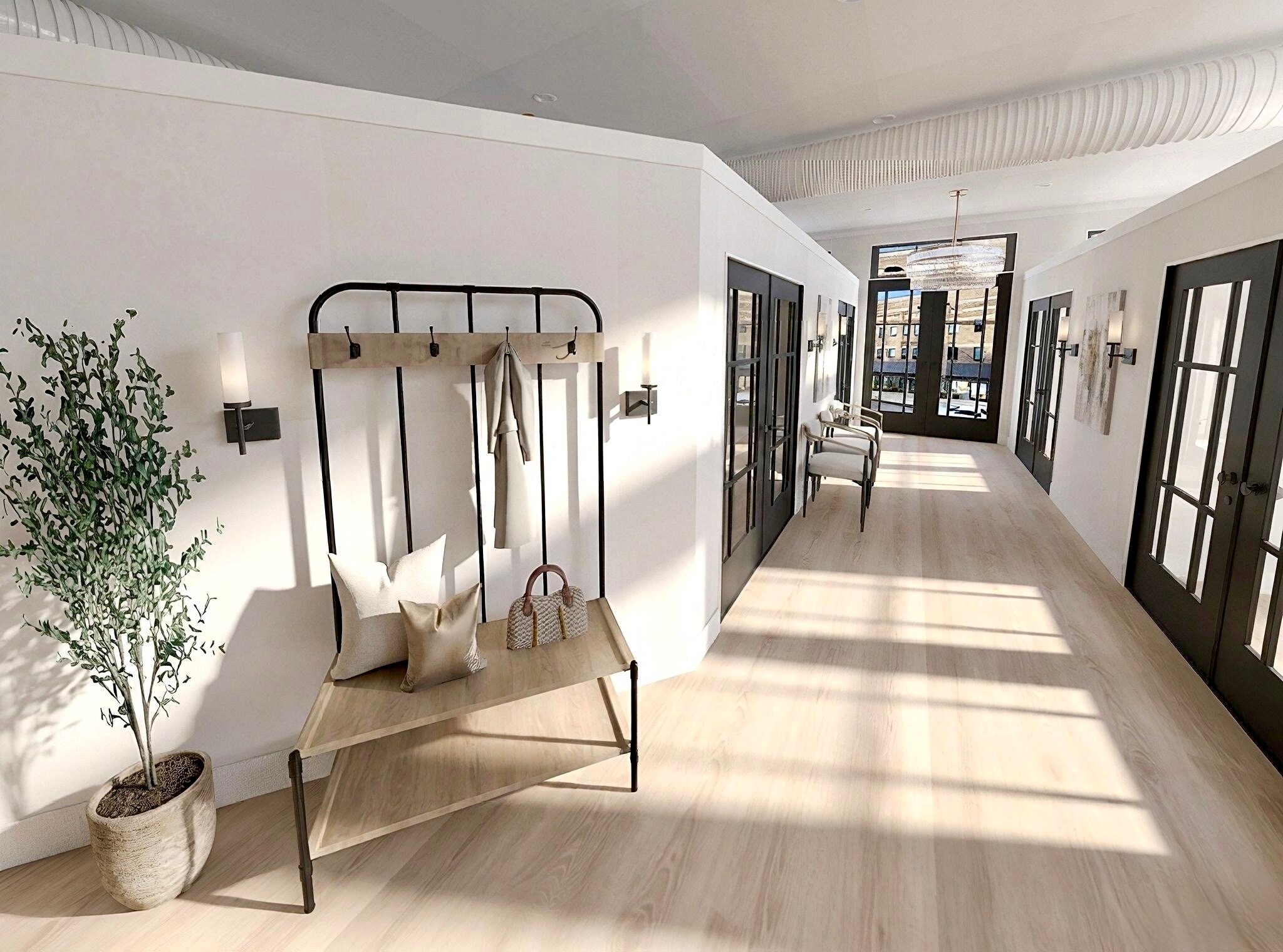 Shared hallway with glass-front private suites